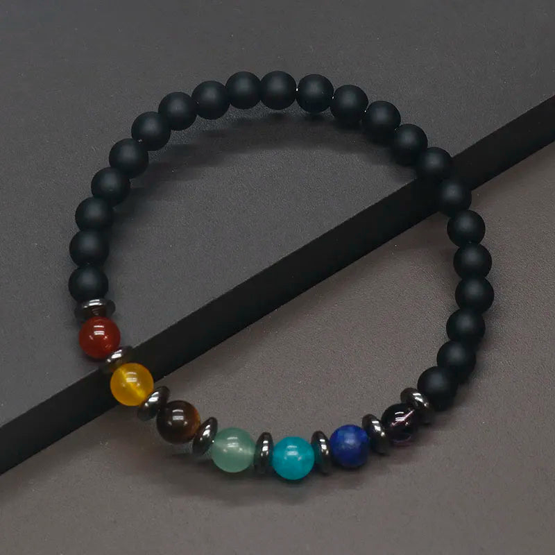 Female Hand Wearing Chakra Bracelet - Lifestyle Shot